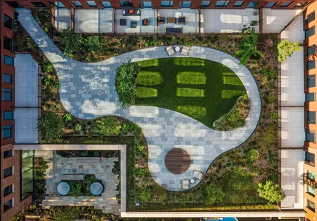 a living room with furniture and a bookshelf