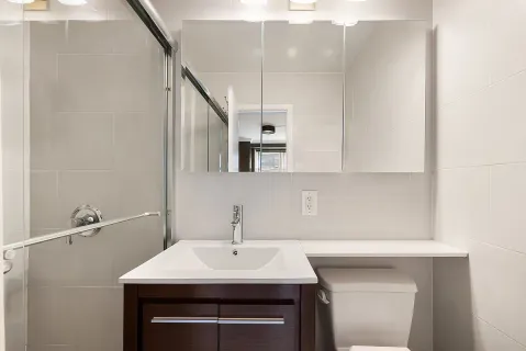 a kitchen with a sink cabinets and window