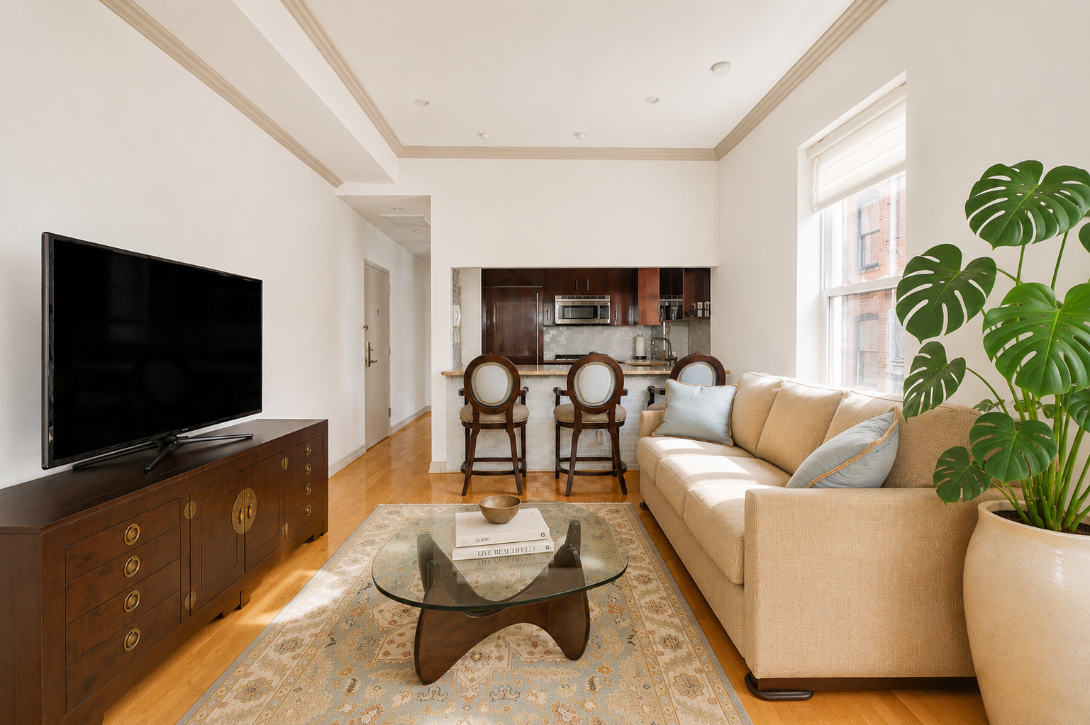 345 West 70th Street, Unit 4E Manhattan, NY 10023 - Photo 1 of 11 a living room with furniture and a flat screen tv