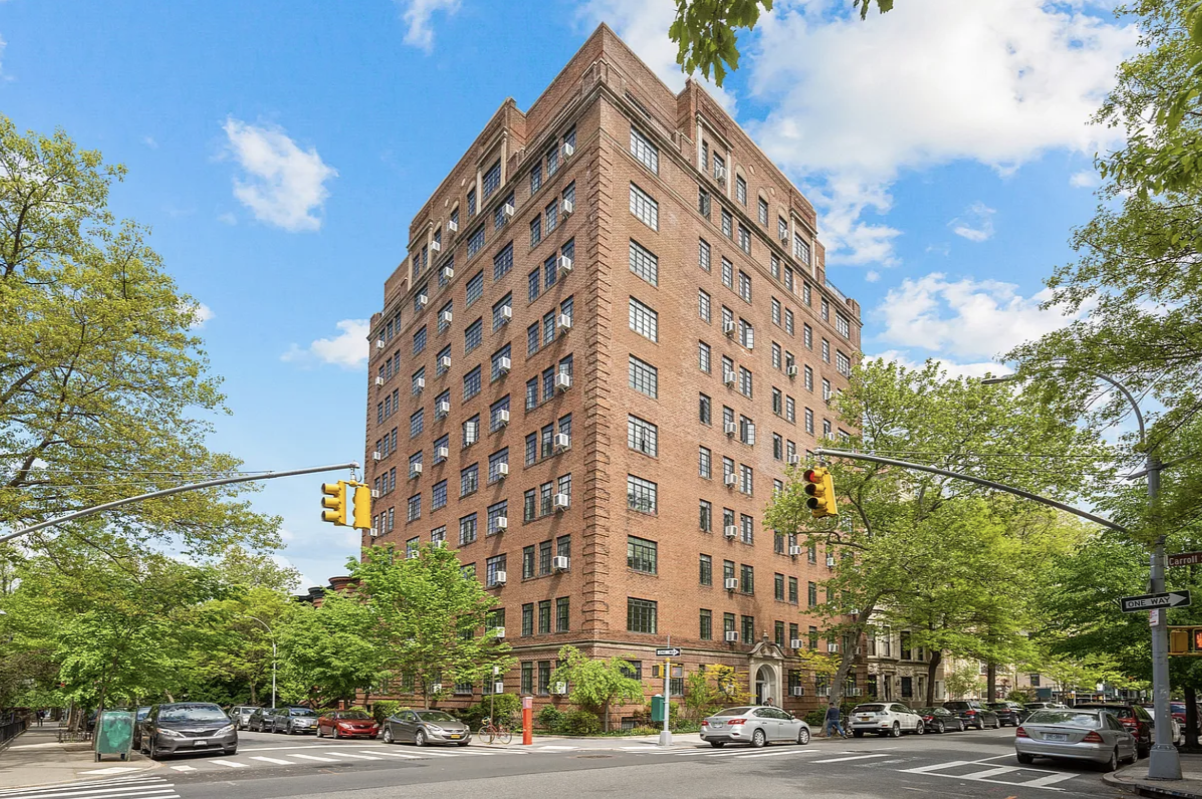 118 8th Avenue, Unit 2F Brooklyn, NY 11215 - Photo 1 of 2 a view of a tall building next to a road