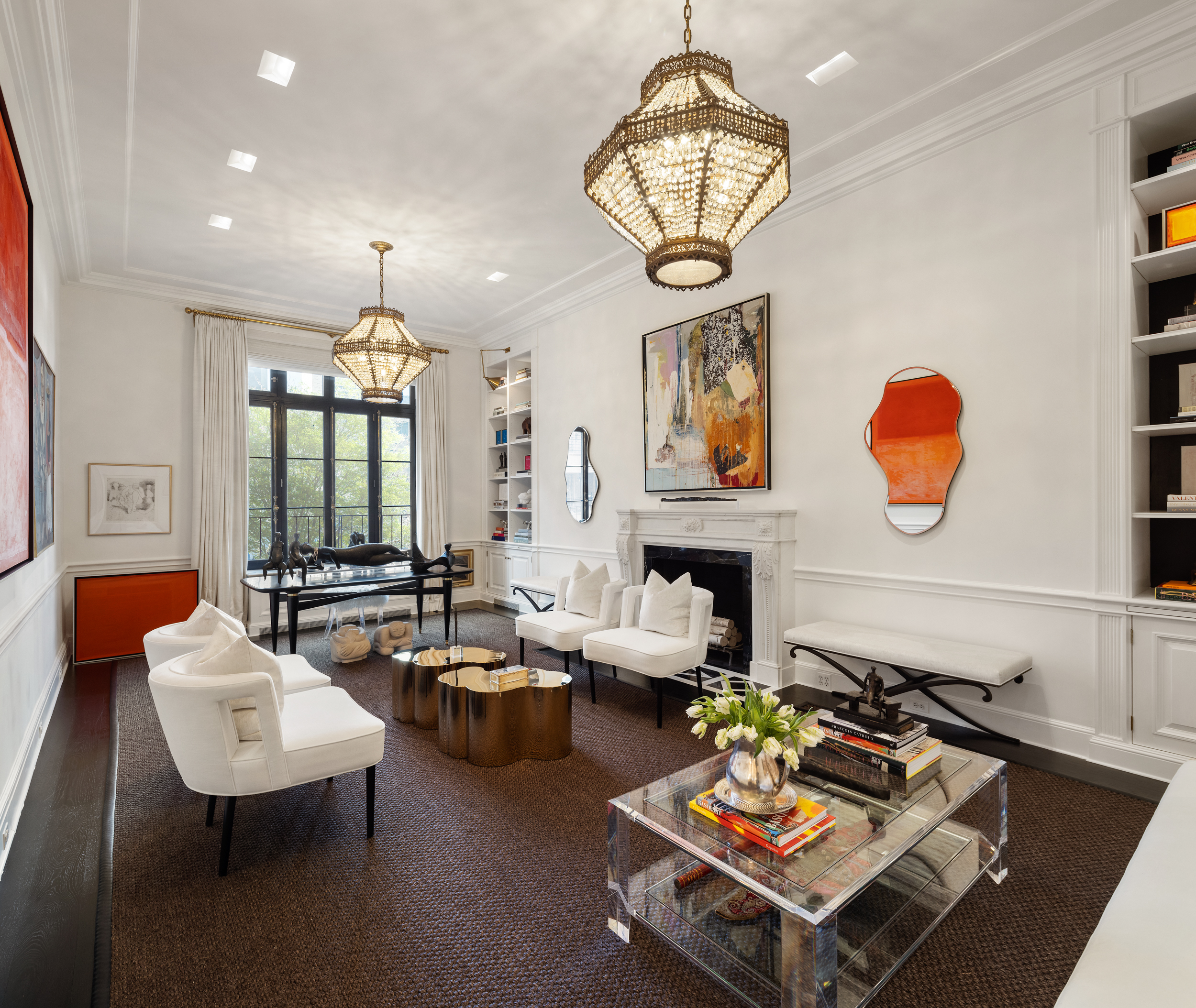 170 East 78th Street, Unit 8E Manhattan, NY 10075 - Photo 1 of 16 a living room with fireplace furniture and a chandelier