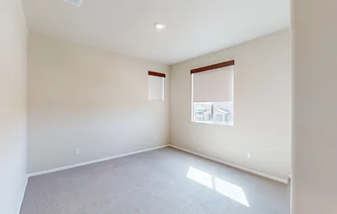 a view of a patio with a table and chairs