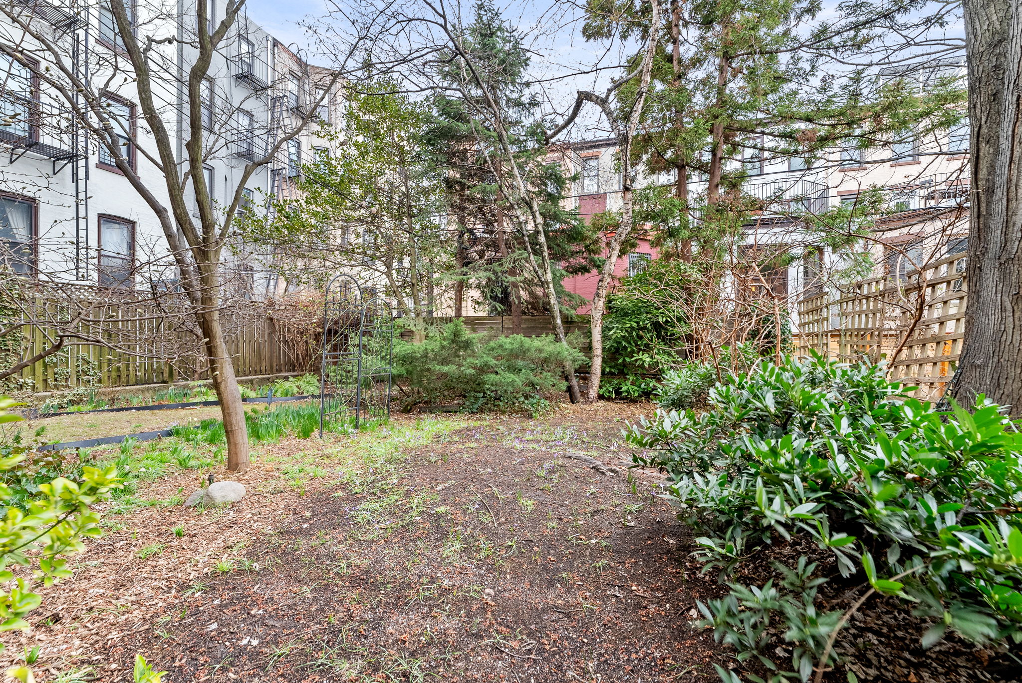 694 10th Street, Unit 2 Brooklyn, NY 11215 - Photo 19 of 22 a backyard of a house with lots of green space