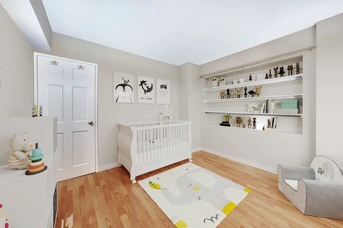 a bedroom with a bed and a wooden floor