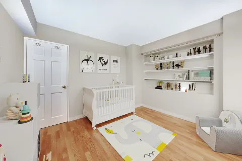 a bedroom with a bed and a wooden floor