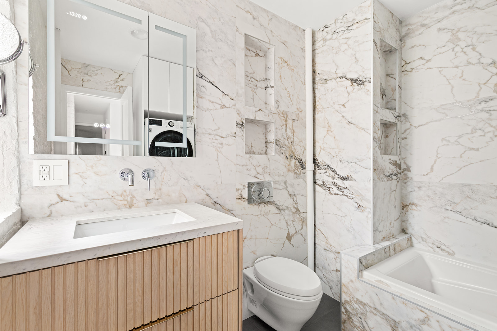 57 Thompson Street, Unit 2CD Manhattan, NY 10012 - Photo 6 of 13 a bathroom with a sink toilet vanity and shower