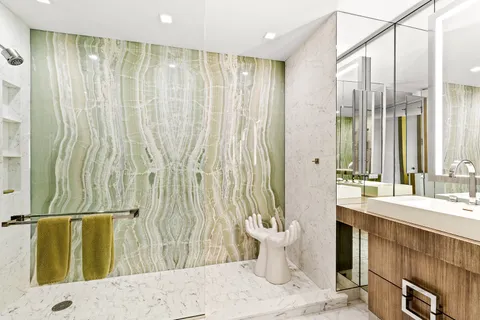 a bathroom with a bathtub and shower