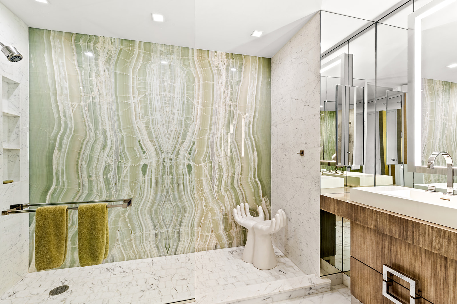 641 5th Avenue, Unit 38F Manhattan, NY 10022 - Photo 7 of 10 a bathroom with a bathtub and shower