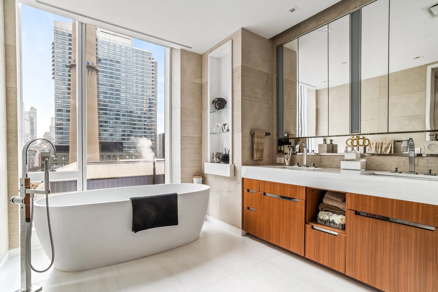 a large white kitchen with a large window and sink