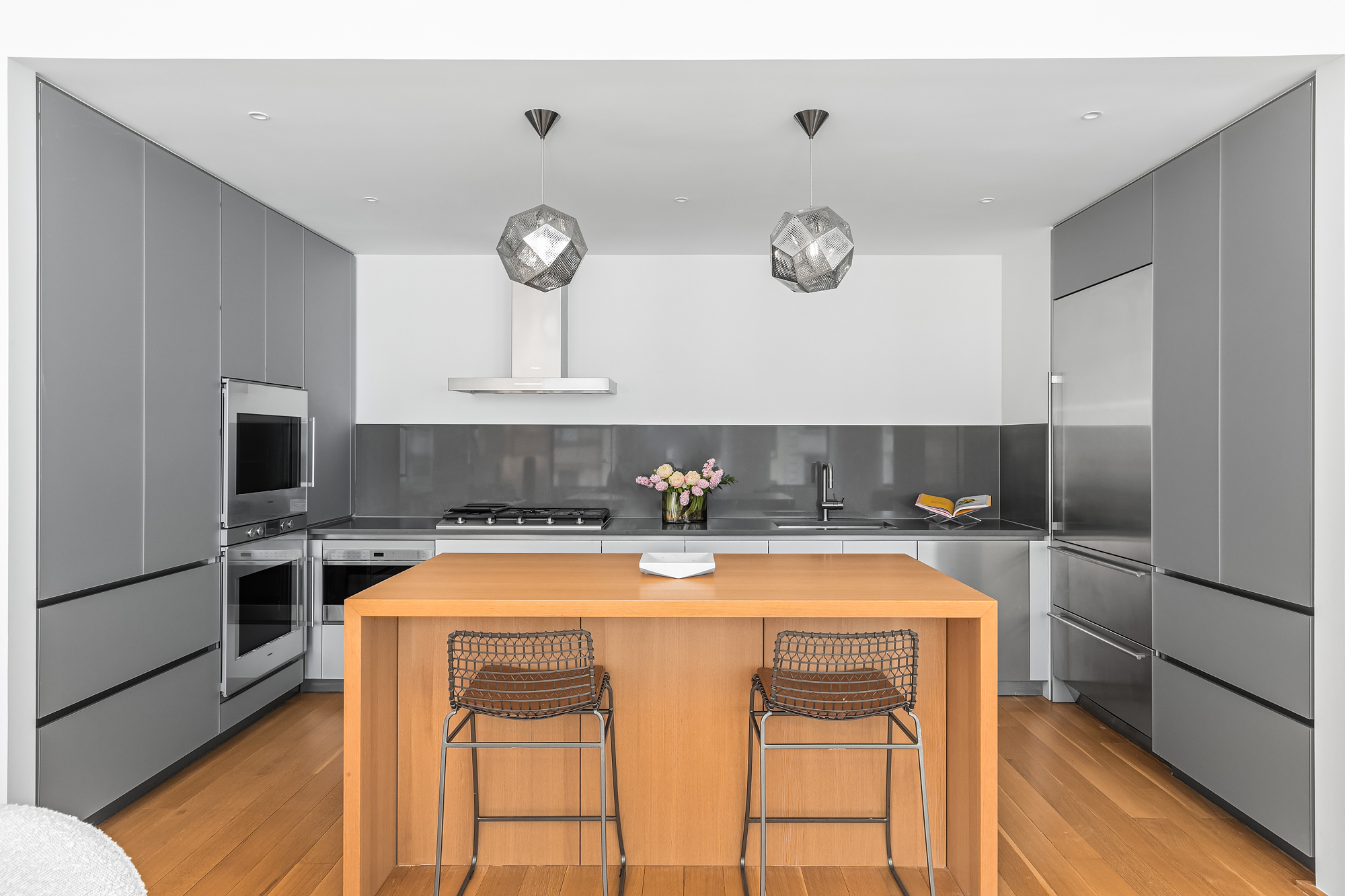 71 Reade Street, Unit 4D Manhattan, NY 10007 - Photo 5 of 15 a kitchen that has a cabinets and a stove top oven
