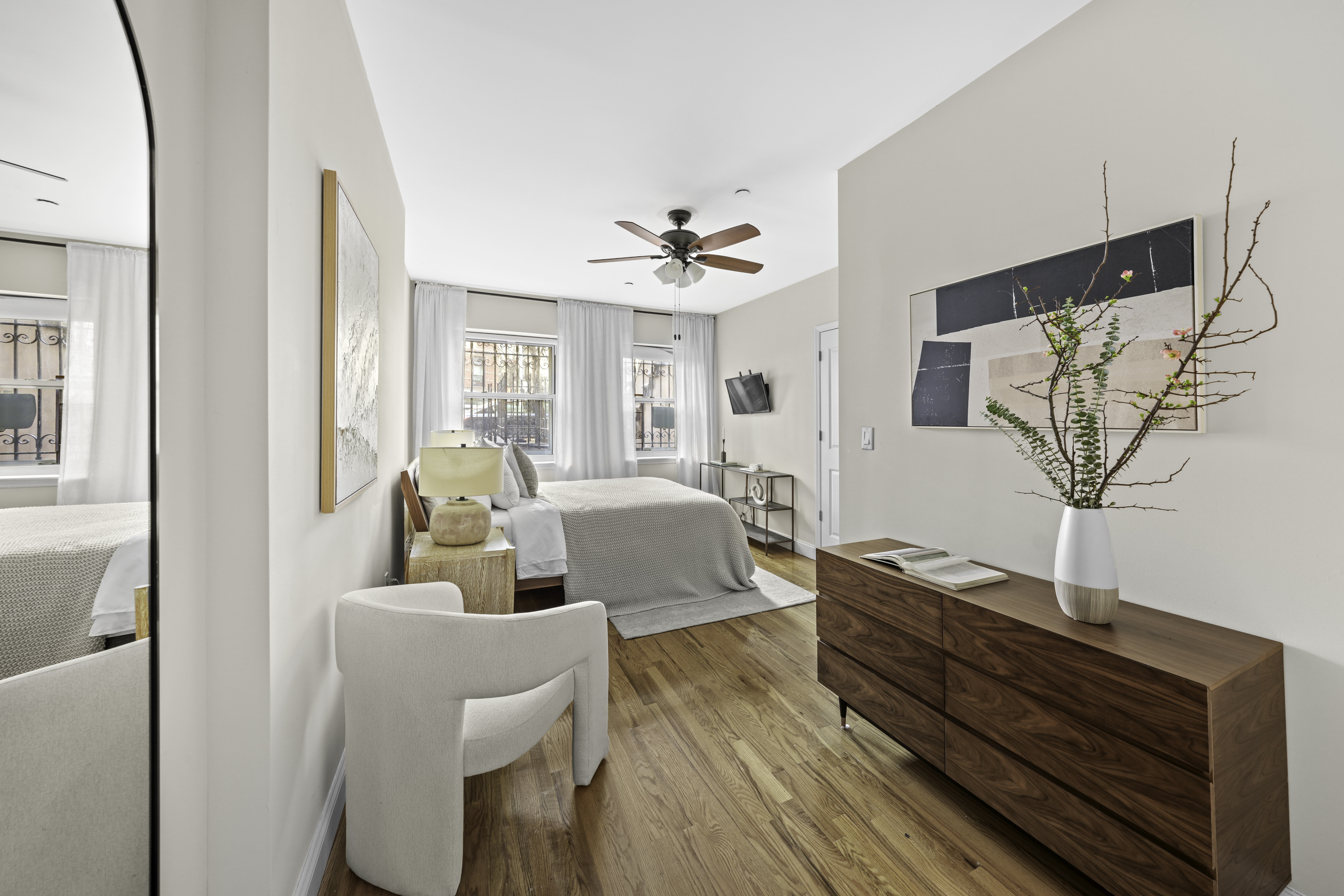 714 St Nicholas Avenue, Unit 1 Manhattan, NY 10031 - Photo 5 of 18 a living room with furniture and a chandelier