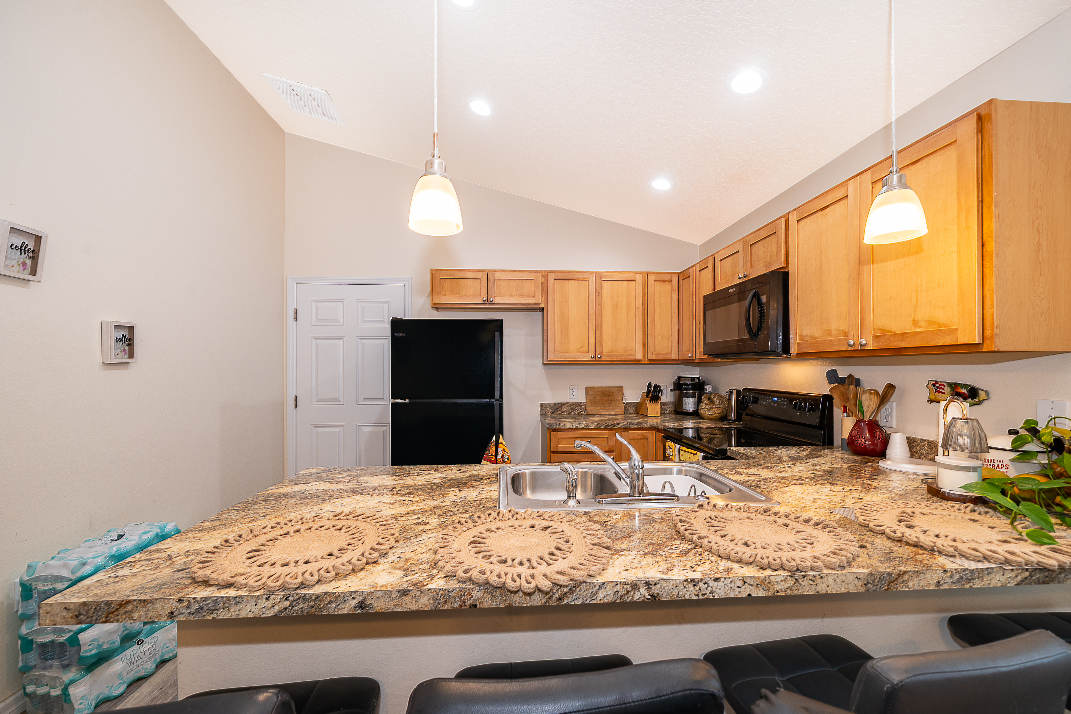 1360 Cottage Circle Tavares, FL 32778 - Photo 8 of 25 a kitchen with stainless steel appliances granite countertop a sink stove and refrigerator