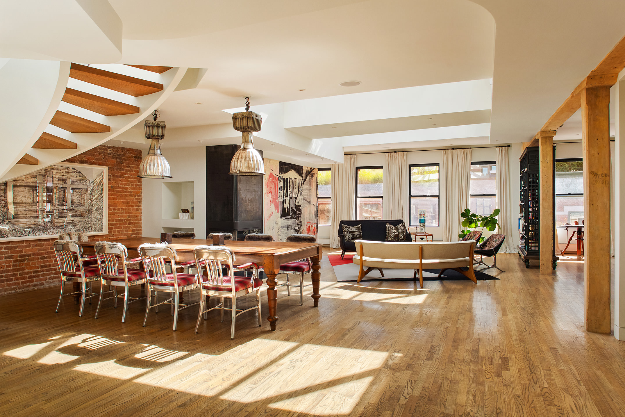 152 Franklin Street, Unit PH Manhattan, NY 10013 - Photo 5 of 17 a living room with lots of furniture and a wooden floor