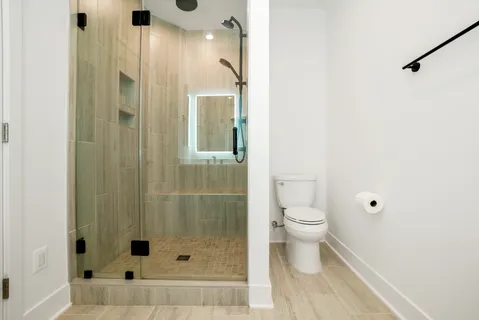 a bathroom with a shower and a toilet