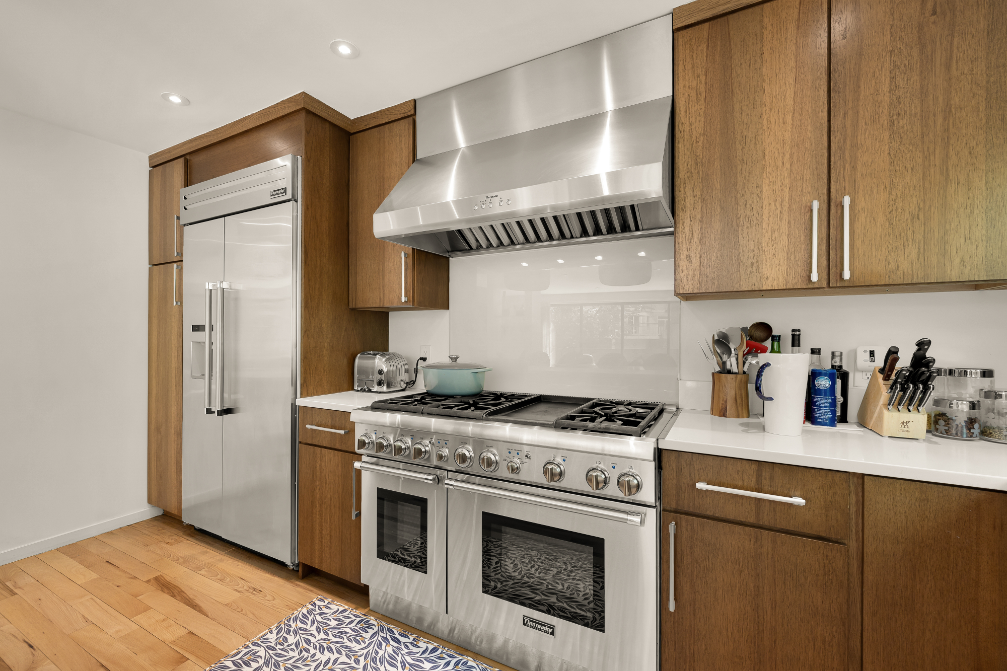 2710 Brandywine Street Northwest Washington, DC 20008 - Photo 16 of 74 a kitchen with stainless steel appliances granite countertop a stove a sink and a refrigerator