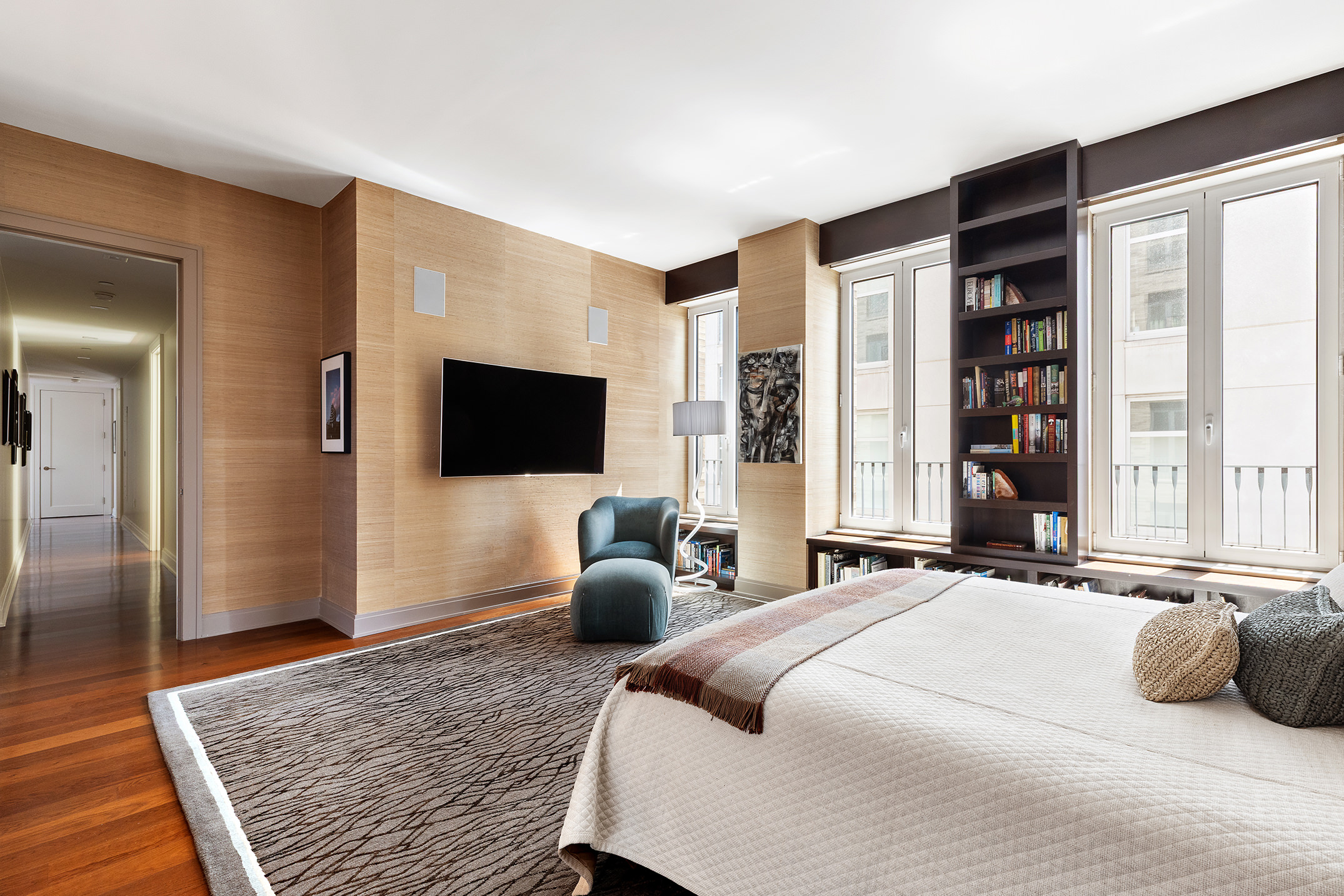 230 West 78th Street, Unit PH19 Manhattan, NY 10024 - Photo 11 of 17 a bedroom with a bed flat screen tv and a large window