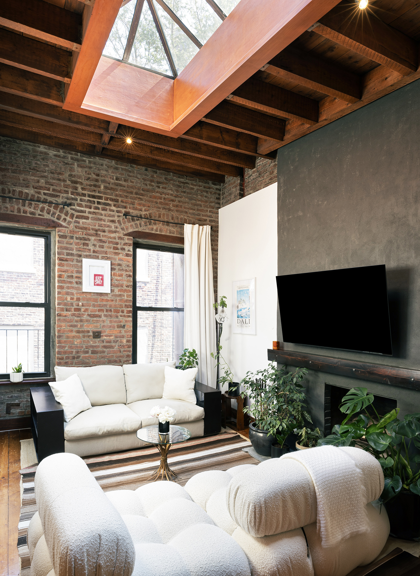 184 Franklin Street, Unit 10 Manhattan, NY 10013 - Photo 4 of 8 a outdoor living space with furniture and a flat screen tv
