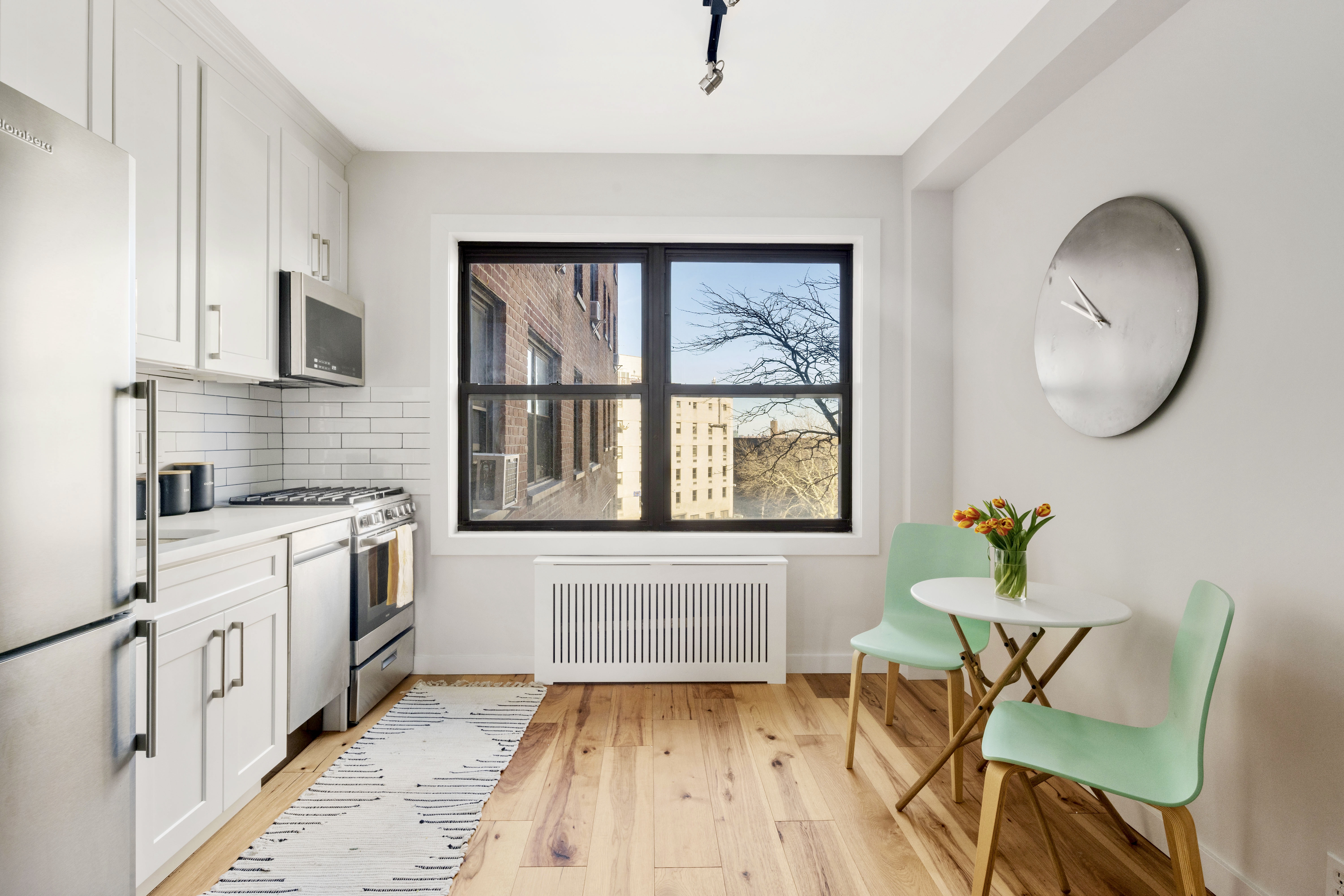 99-72 66th Road, Unit 3R Queens, NY 11374 - Photo 2 of 10 a living room with furniture and a window
