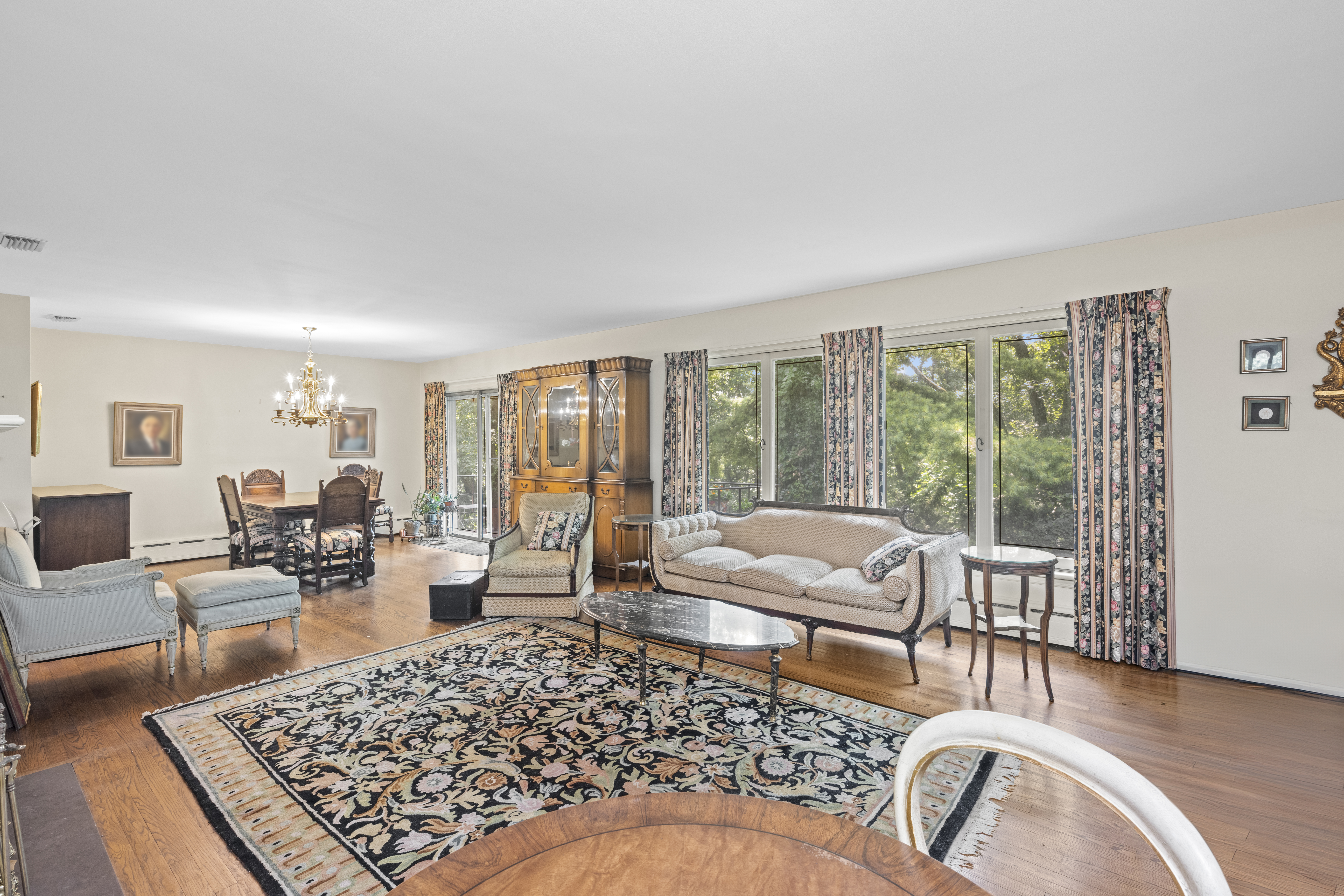 420 Ocean Terrace Staten Island, NY 10301 - Photo 13 of 28 a living room with furniture floor to ceiling window and wooden floor