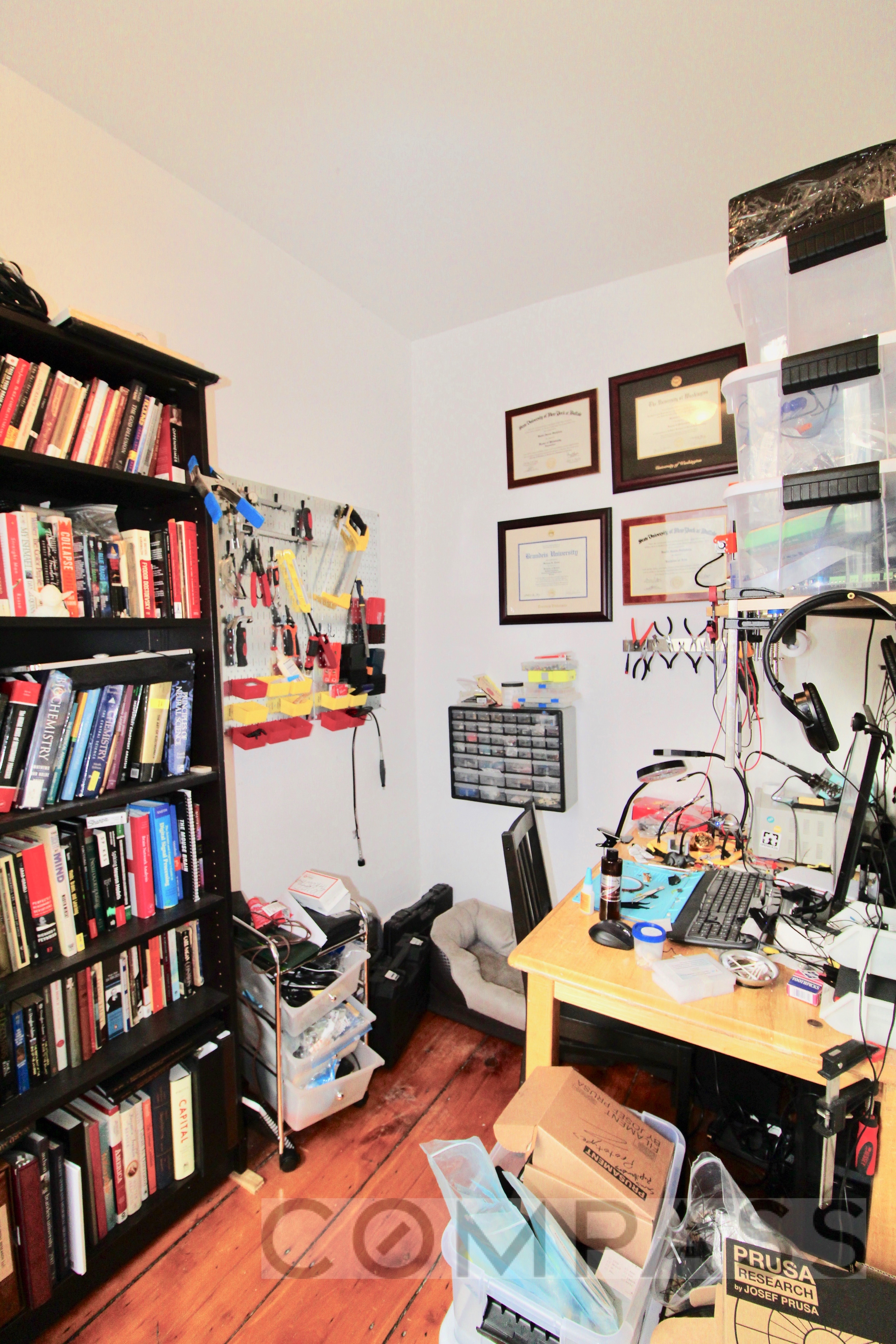 53 Duffield Street, Unit 3 Brooklyn, NY 11201 - Photo 5 of 11 a living room with furniture and book shelf