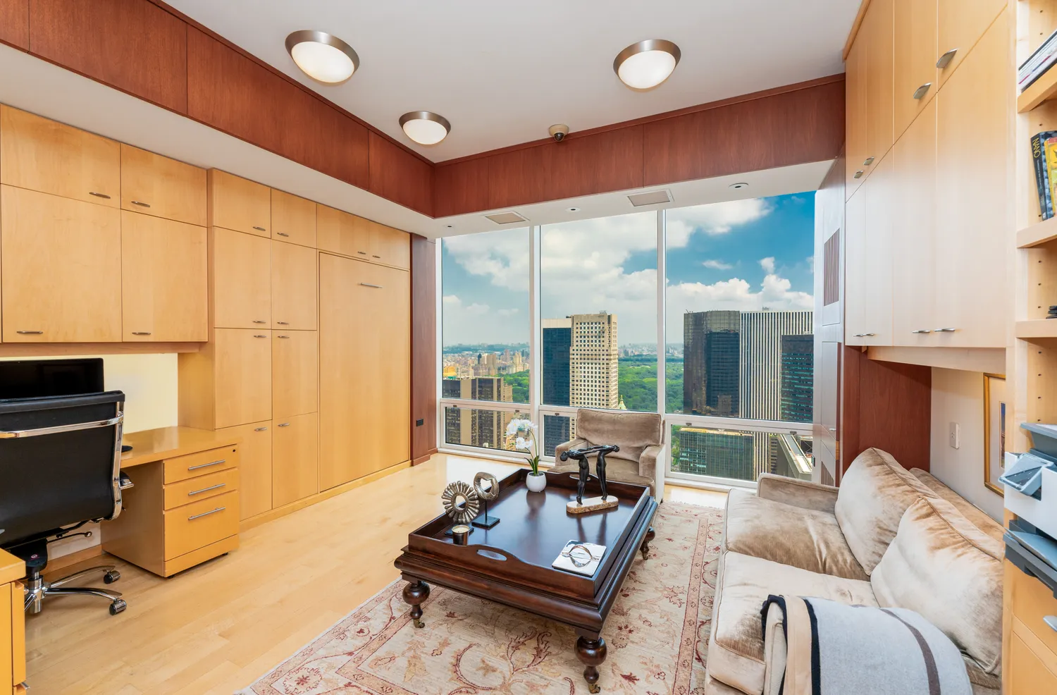 a bedroom with a large bed and a flat tv screen on the dresser