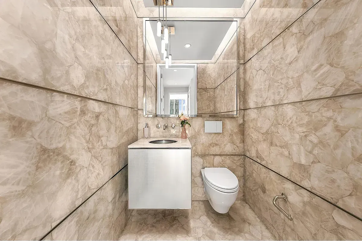 a bathroom with a toilet and a sink