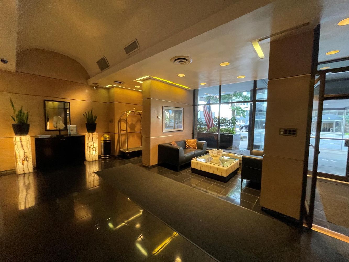 40 Sutton Place, Unit 8D Manhattan, NY 10022 - Photo 8 of 12 a lobby with furniture and window