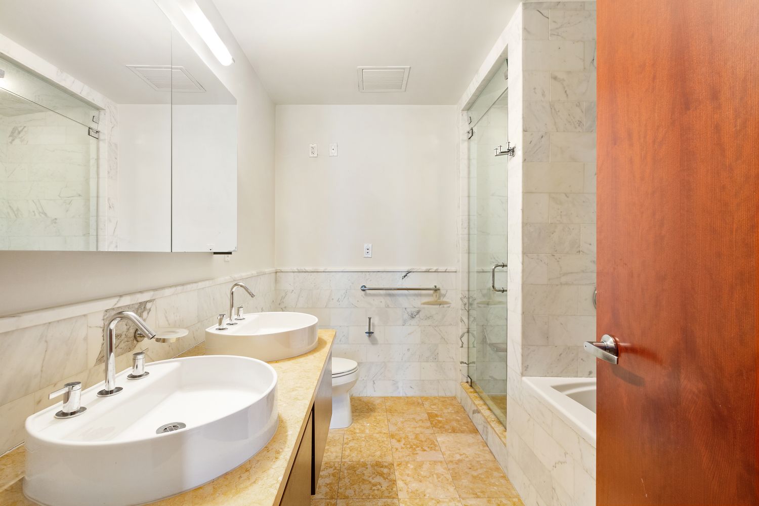 125 West 21st Street, Unit 5B Manhattan, NY 10011 - Photo 8 of 15 a bathroom with a sink and a mirror