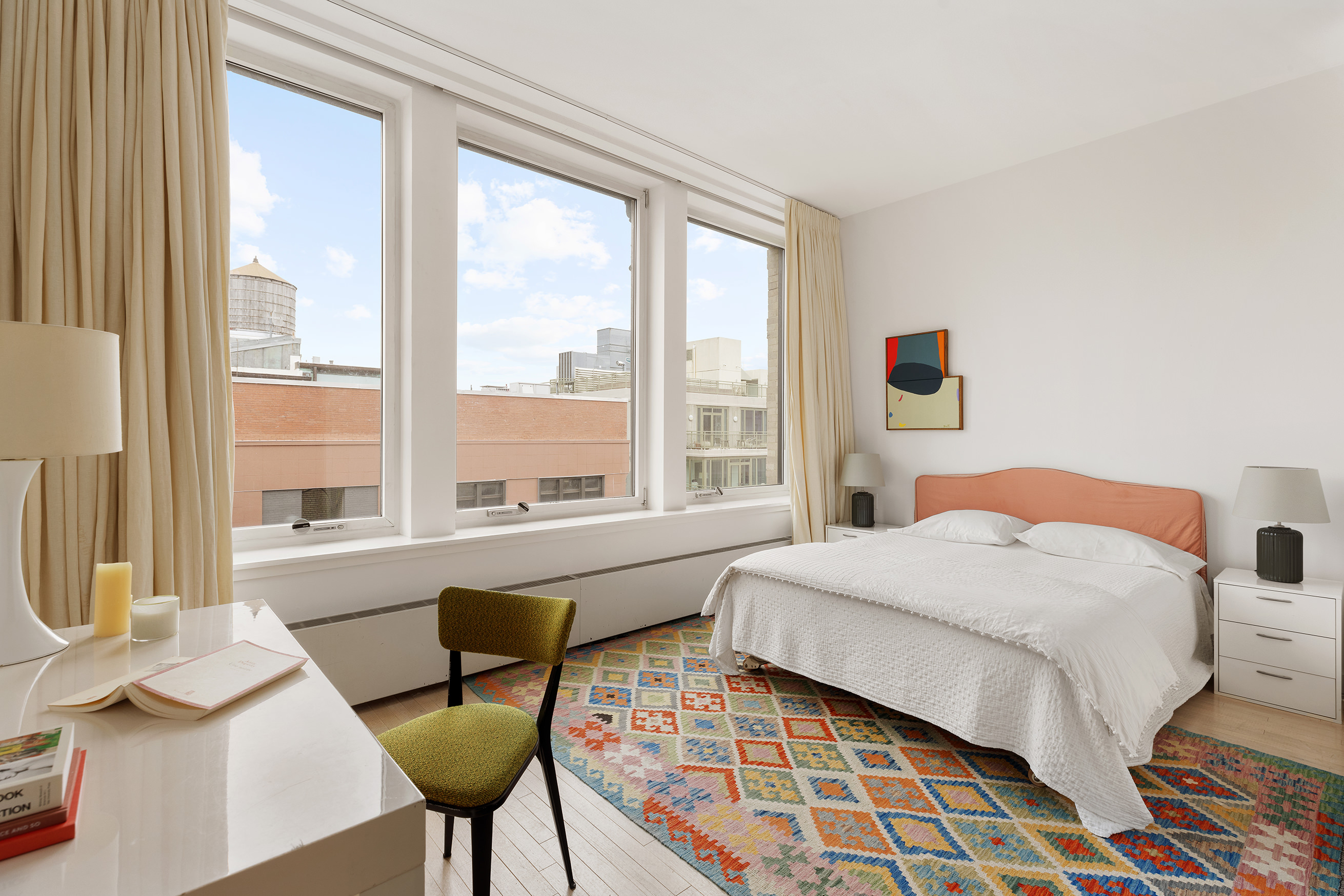 121 West 19th Street, Unit 10C Manhattan, NY 10011 - Photo 5 of 14 a bedroom with a bed and a window