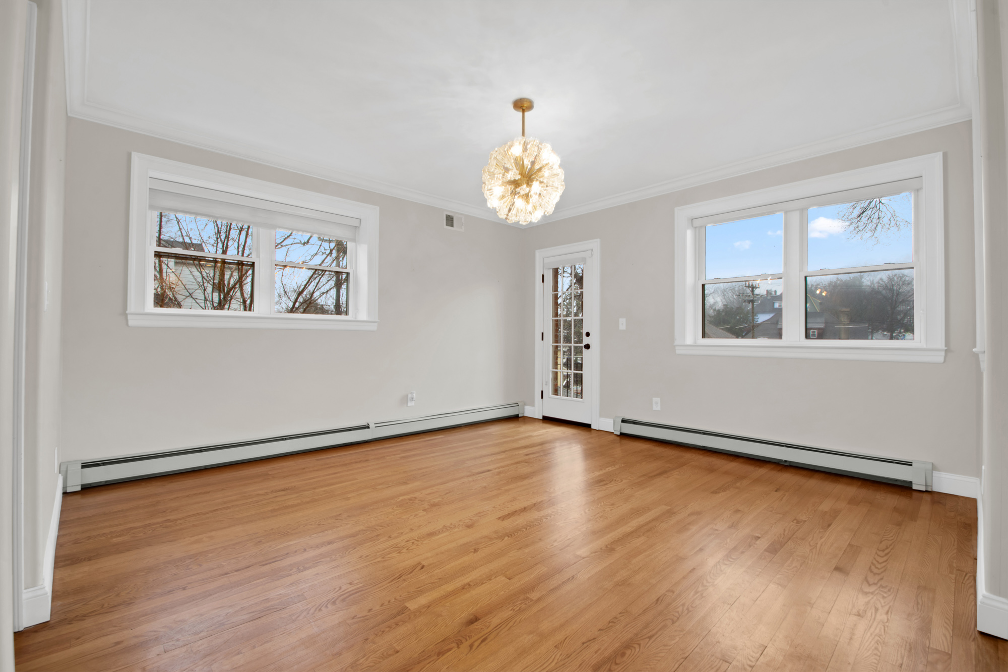11 Nixon Avenue Staten Island, NY 10304 - Photo 9 of 29 a view of an empty room with wooden floor and a window