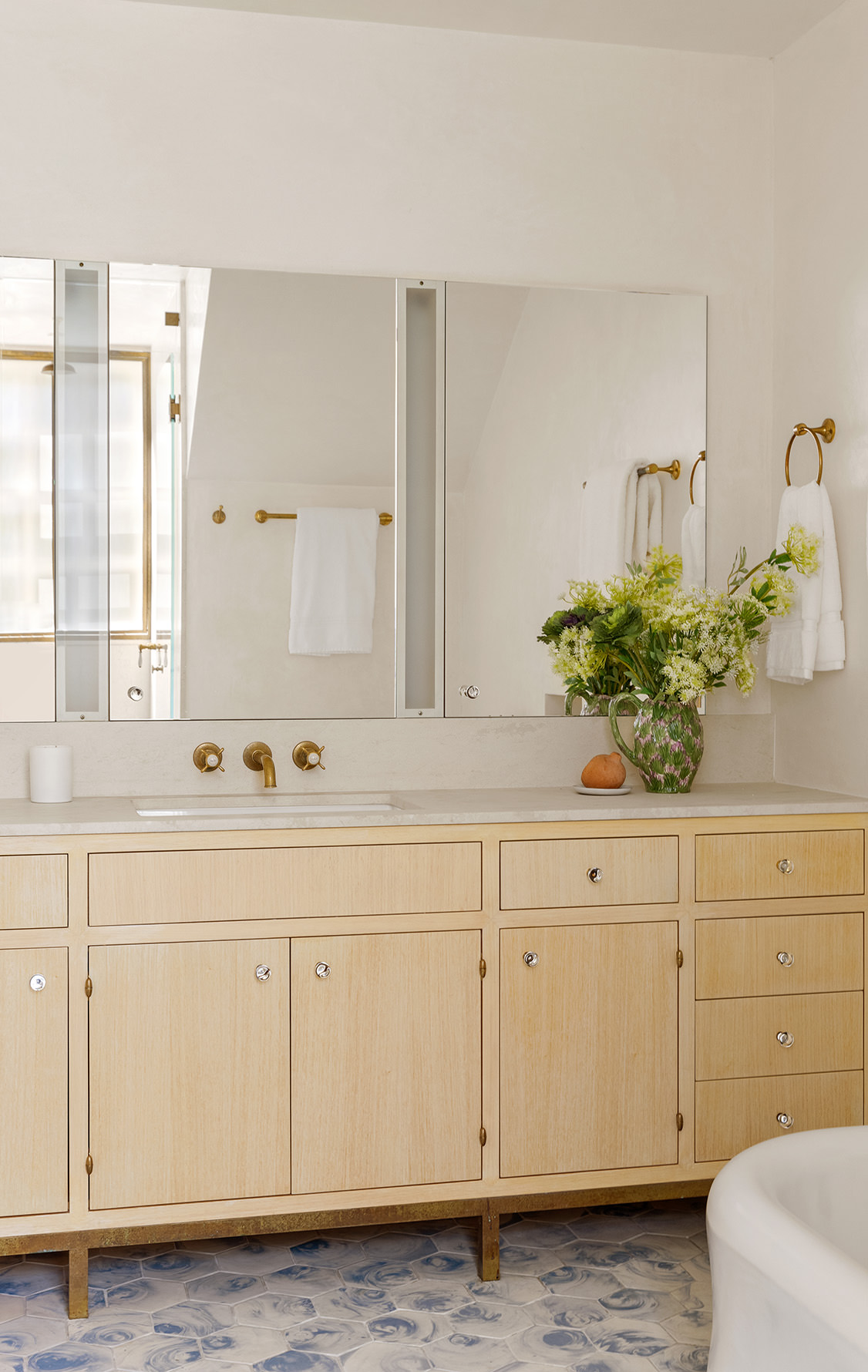 37 Harrison Street Manhattan, NY 10013 - Photo 12 of 26 a bathroom with a sink and a mirror