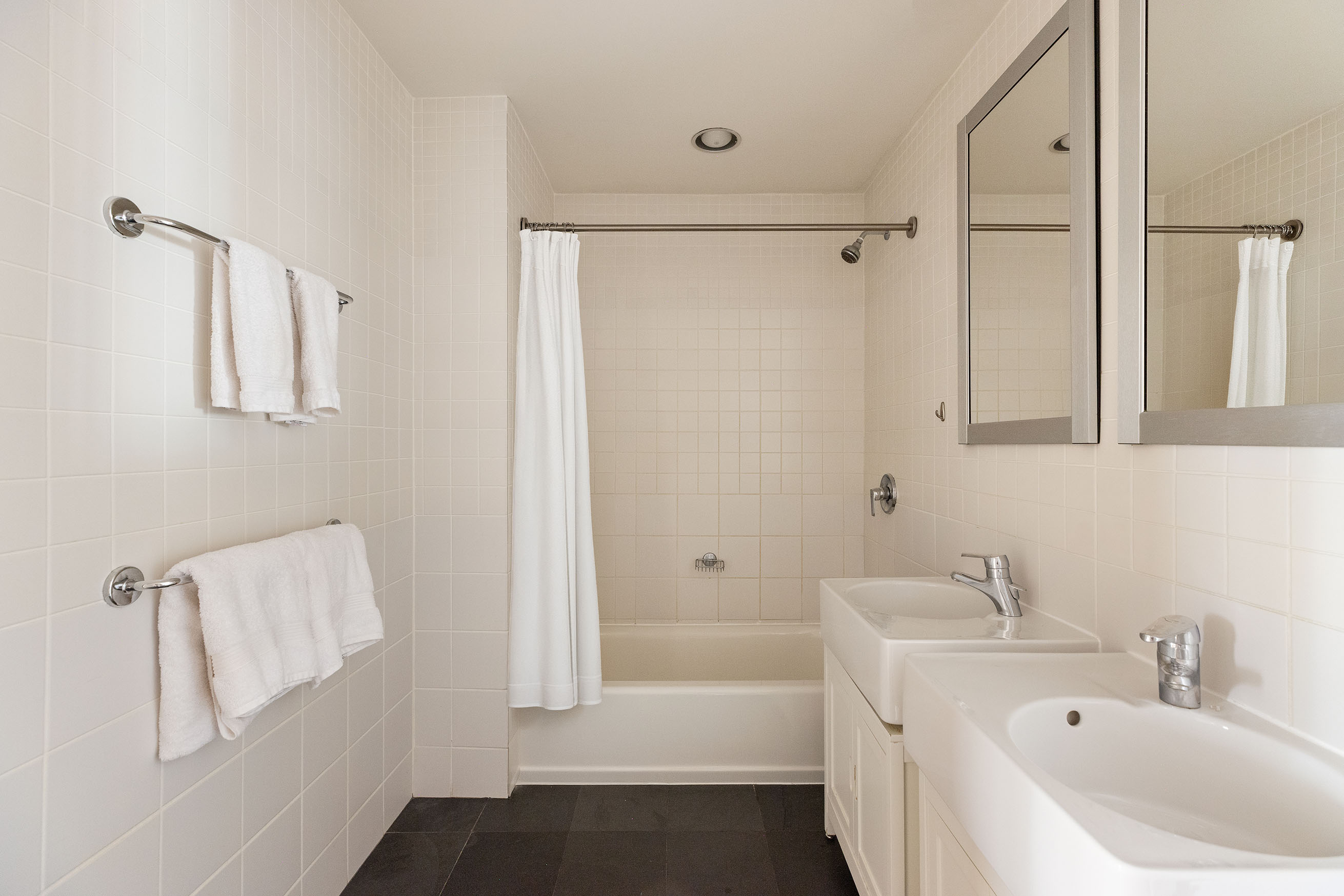 80 Chambers Street, Unit 11A Manhattan, NY 10007 - Photo 10 of 24 a bathroom with a bathtub and a sink