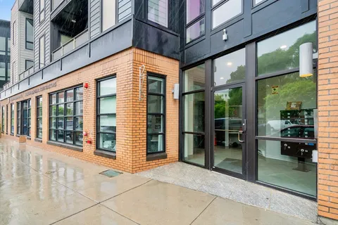 a view of entrance with a building and stairs