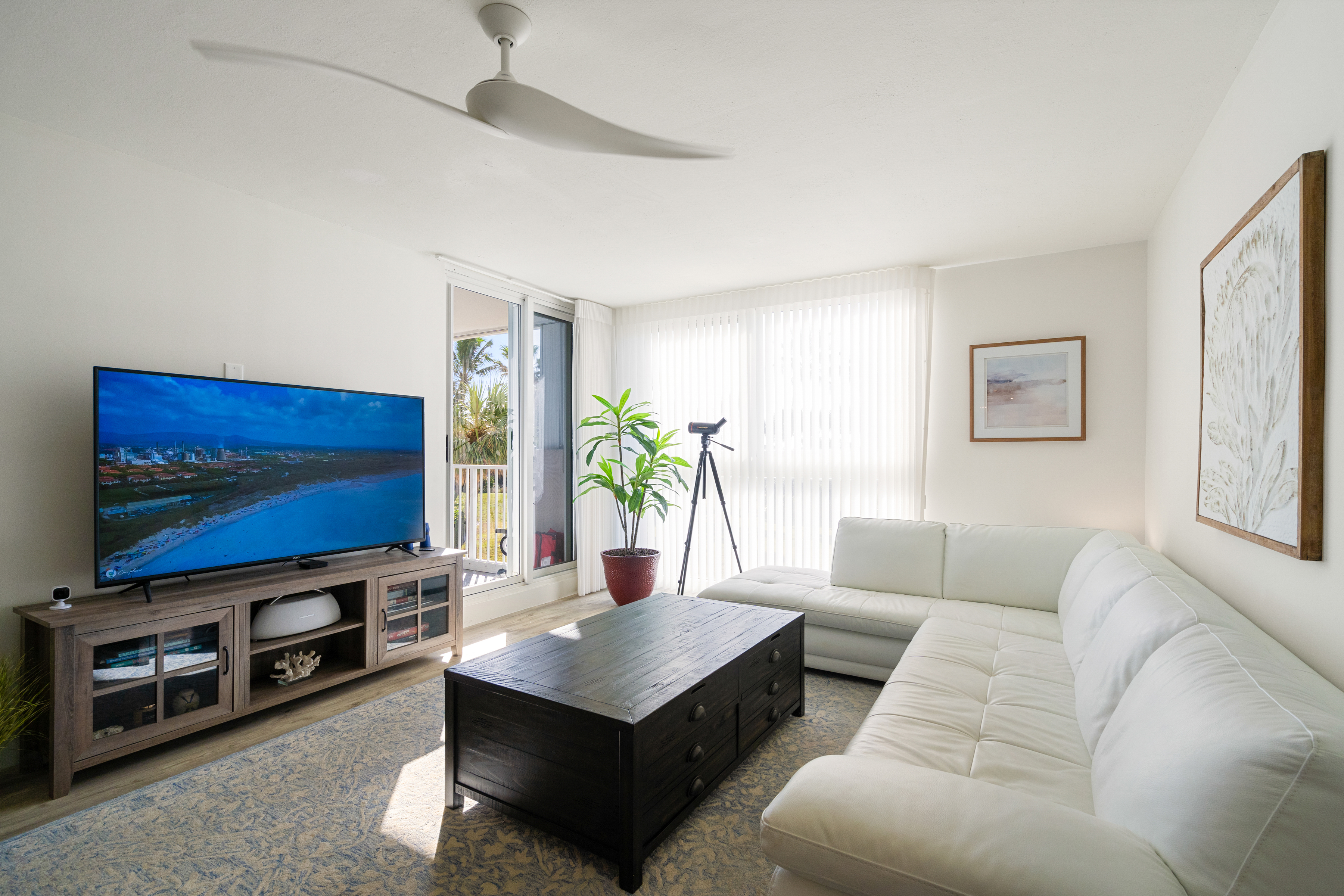 2700 North Highway A1a, Unit 207 Fort Pierce, FL 34949 - Photo 18 of 36 a living room with furniture and a flat screen tv