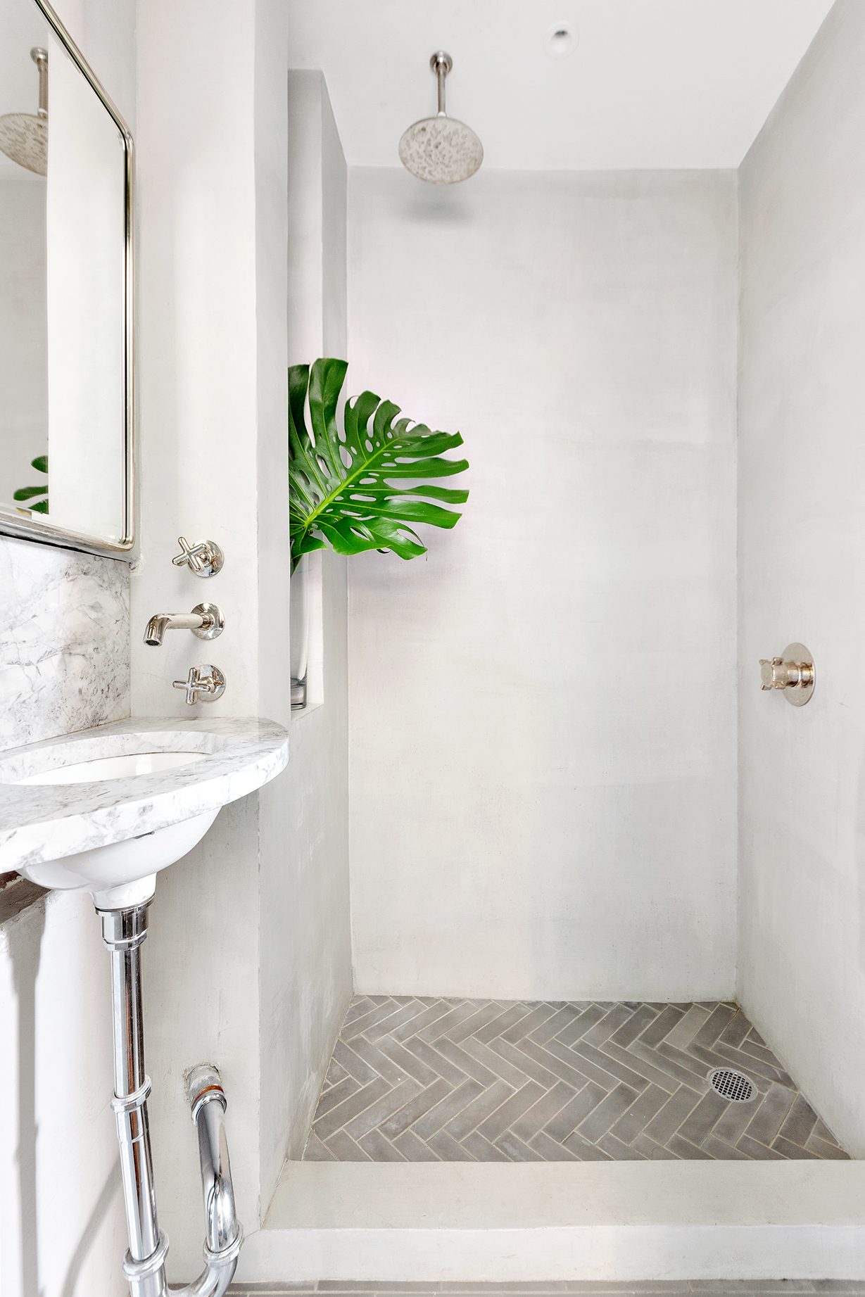 110 Thompson Street, Unit 6E Manhattan, NY 10012 - Photo 7 of 8 a bathroom with a sink and a mirror