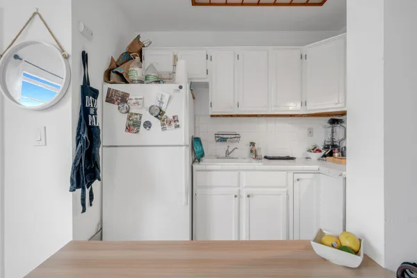 a bathroom with a sink a mirror and a shower