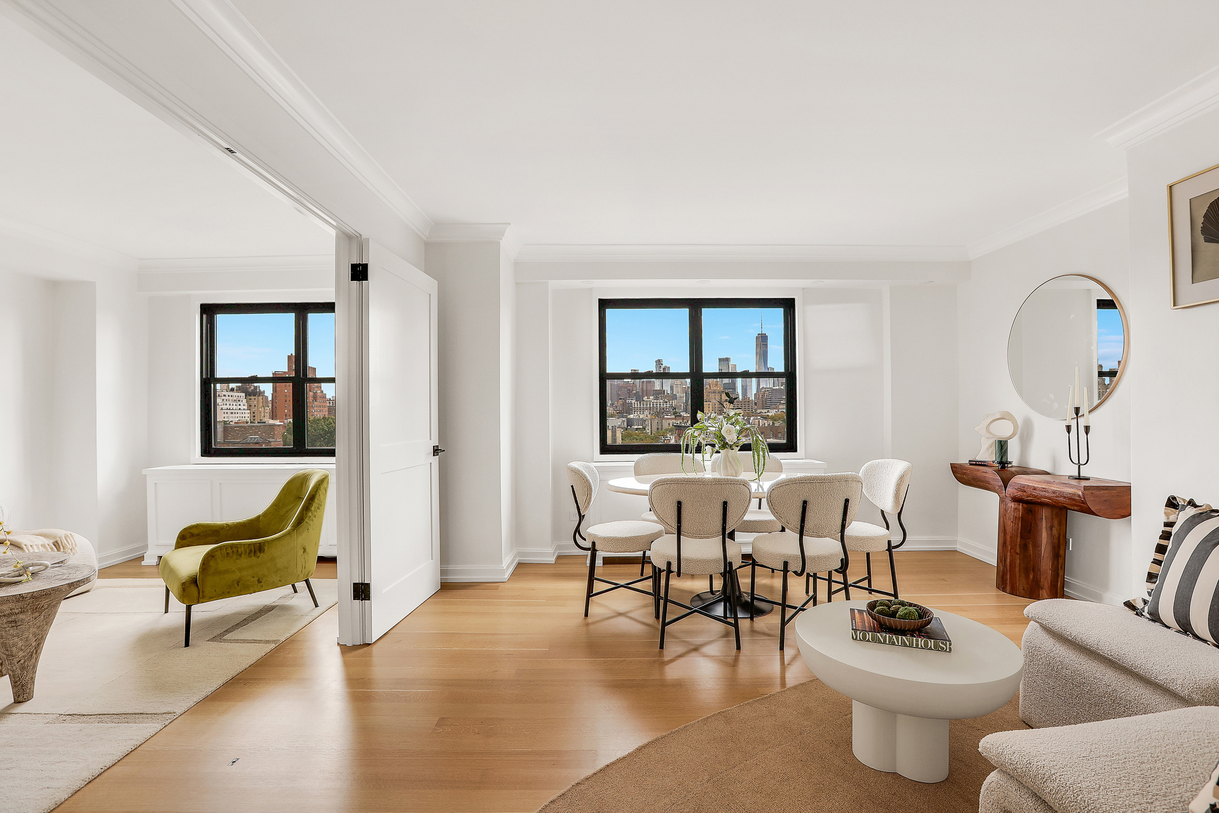 31 Jane Street, Unit 10FG Manhattan, NY 10014 - Photo 2 of 27 a living room with furniture and a wooden floor