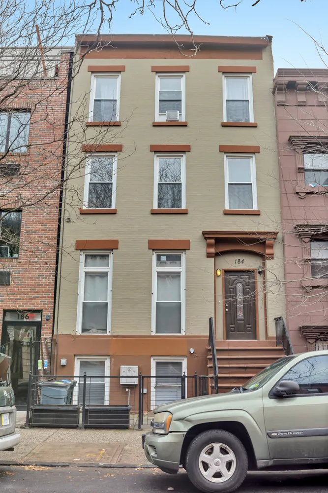 a front view of a building with parking space