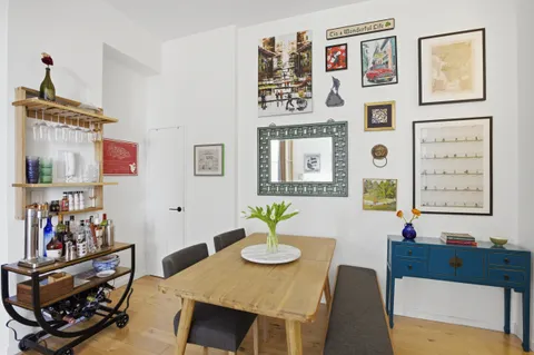 a view of a dining room with furniture kitchen and wooden floor