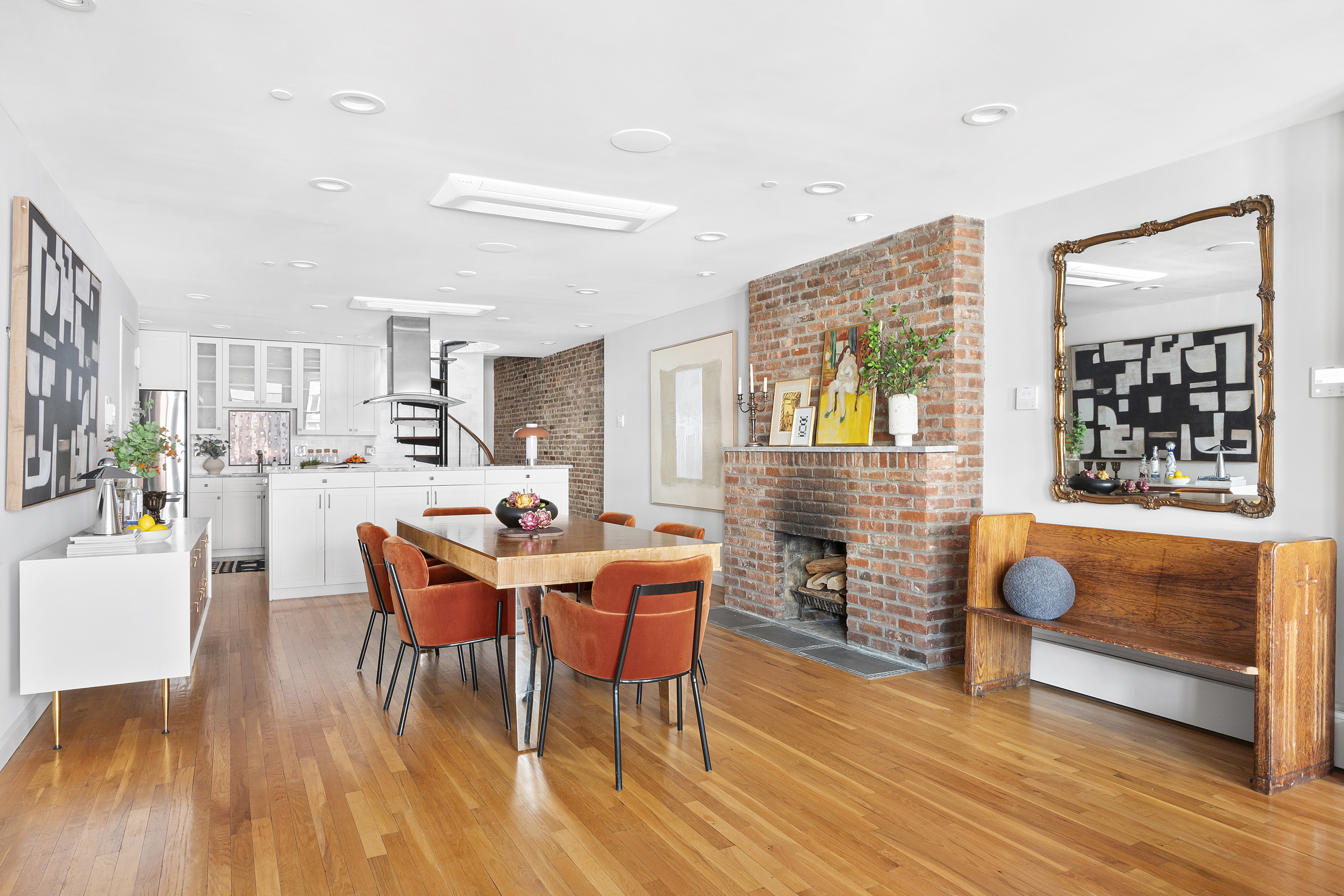120 West 20th Street, Unit PH Manhattan, NY 10011 - Photo 5 of 15 a dining room with furniture and wooden floor