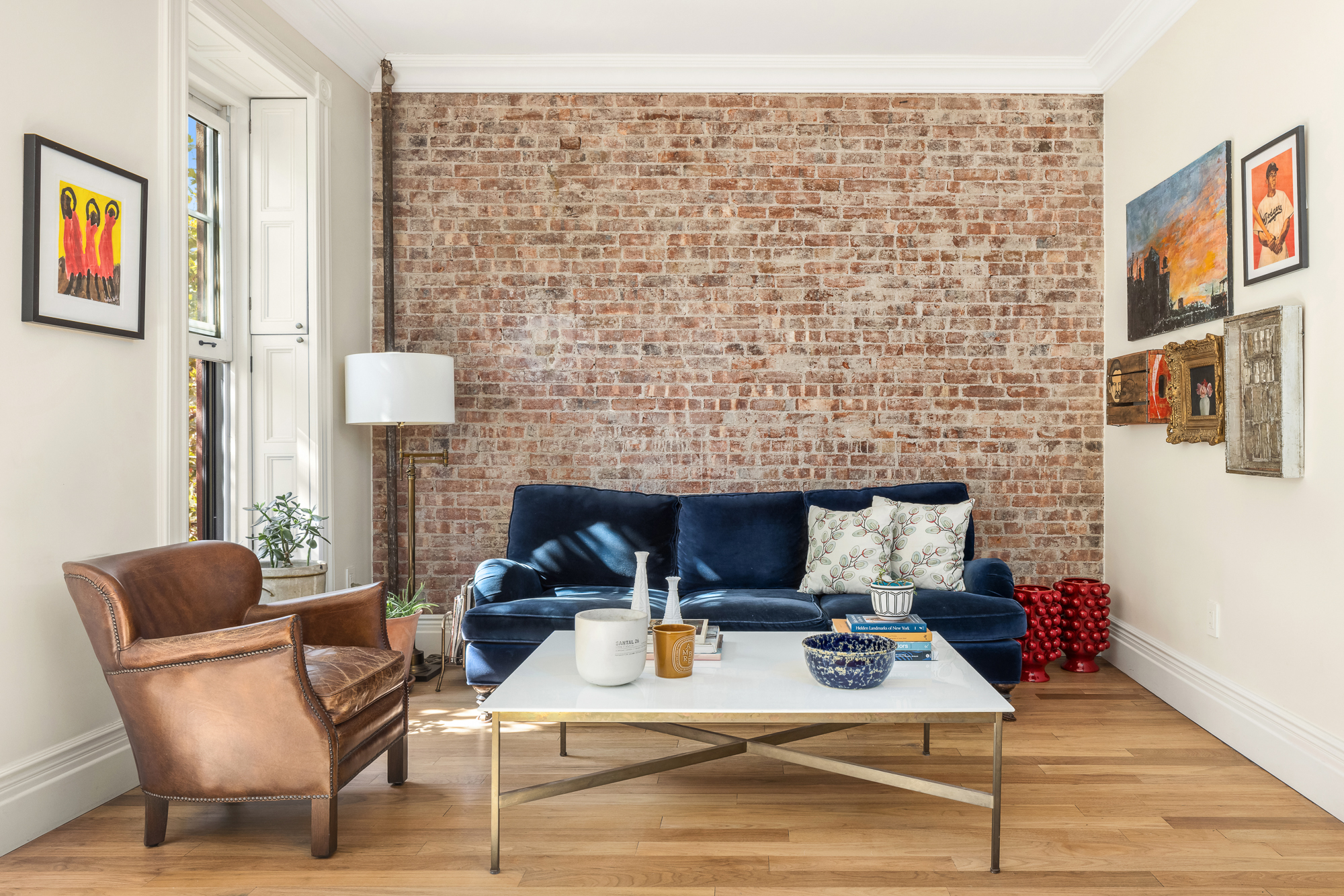 67 Perry Street, Unit 4 Manhattan, NY 10014 - Photo 5 of 15 a living room with furniture and a table