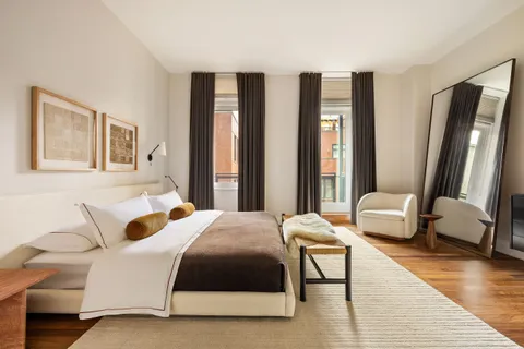 a bedroom with a bed and a couch