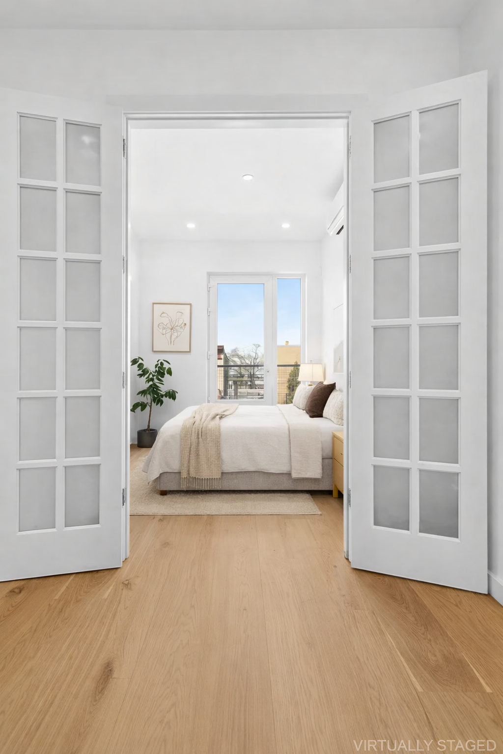 138 Schaefer Street, Unit 3 Brooklyn, NY 11207 - Photo 6 of 11 a bedroom with a large bed and a window