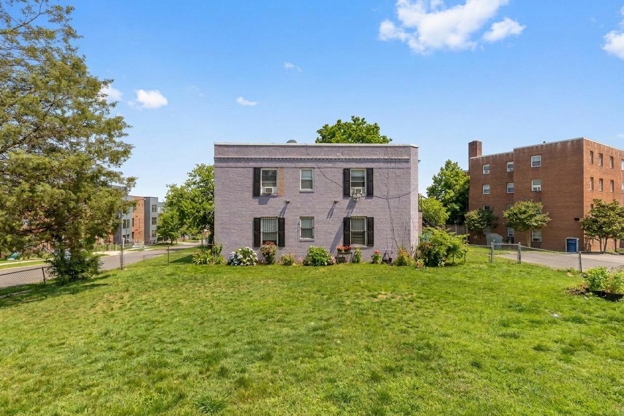 928 19th Street Northeast Washington, DC 20002 - Photo 12 of 13 a view of a house with a big yard and a large tree