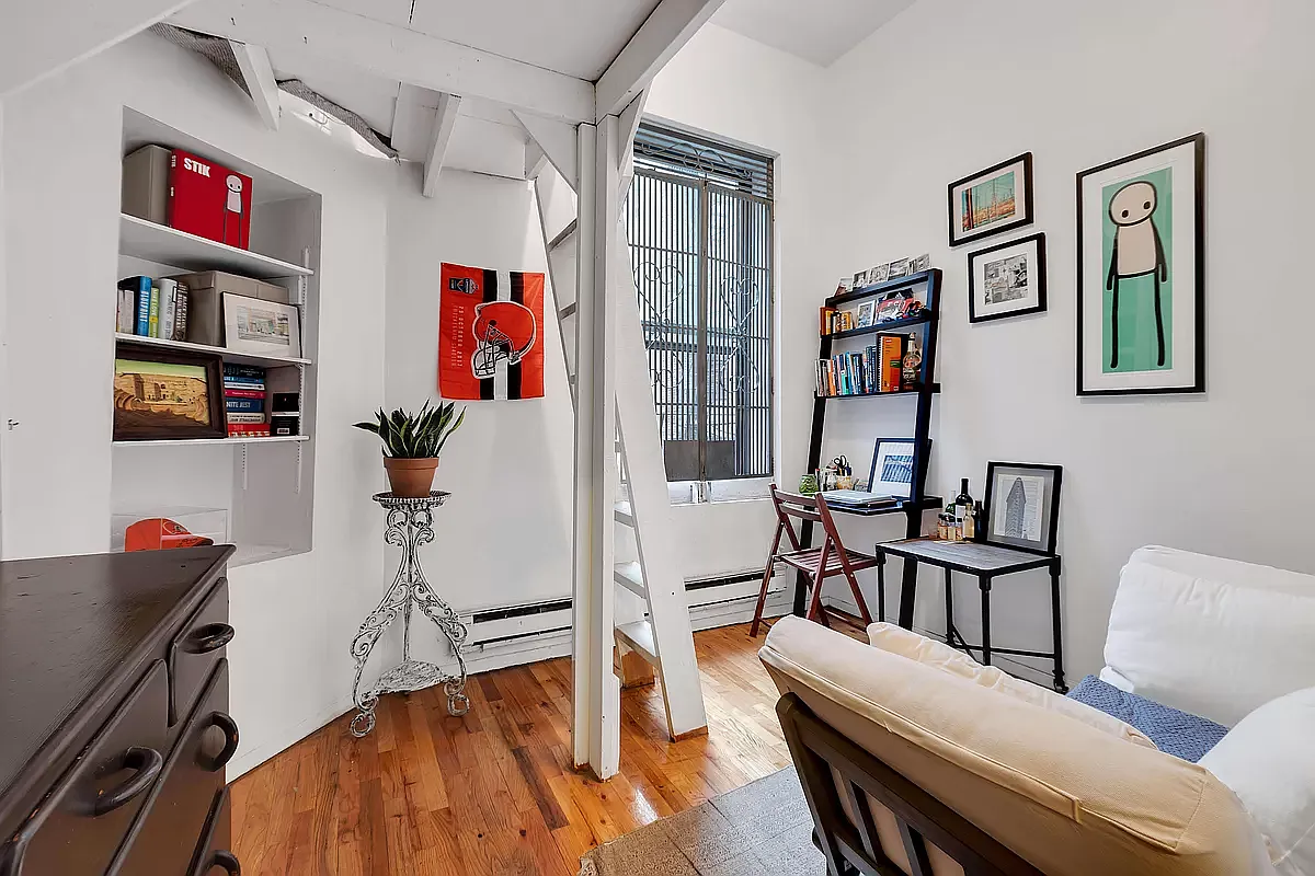 949 Columbus Avenue, Unit 1 Manhattan, NY 10025 - Photo 3 of 6 a living room with furniture and wooden floor