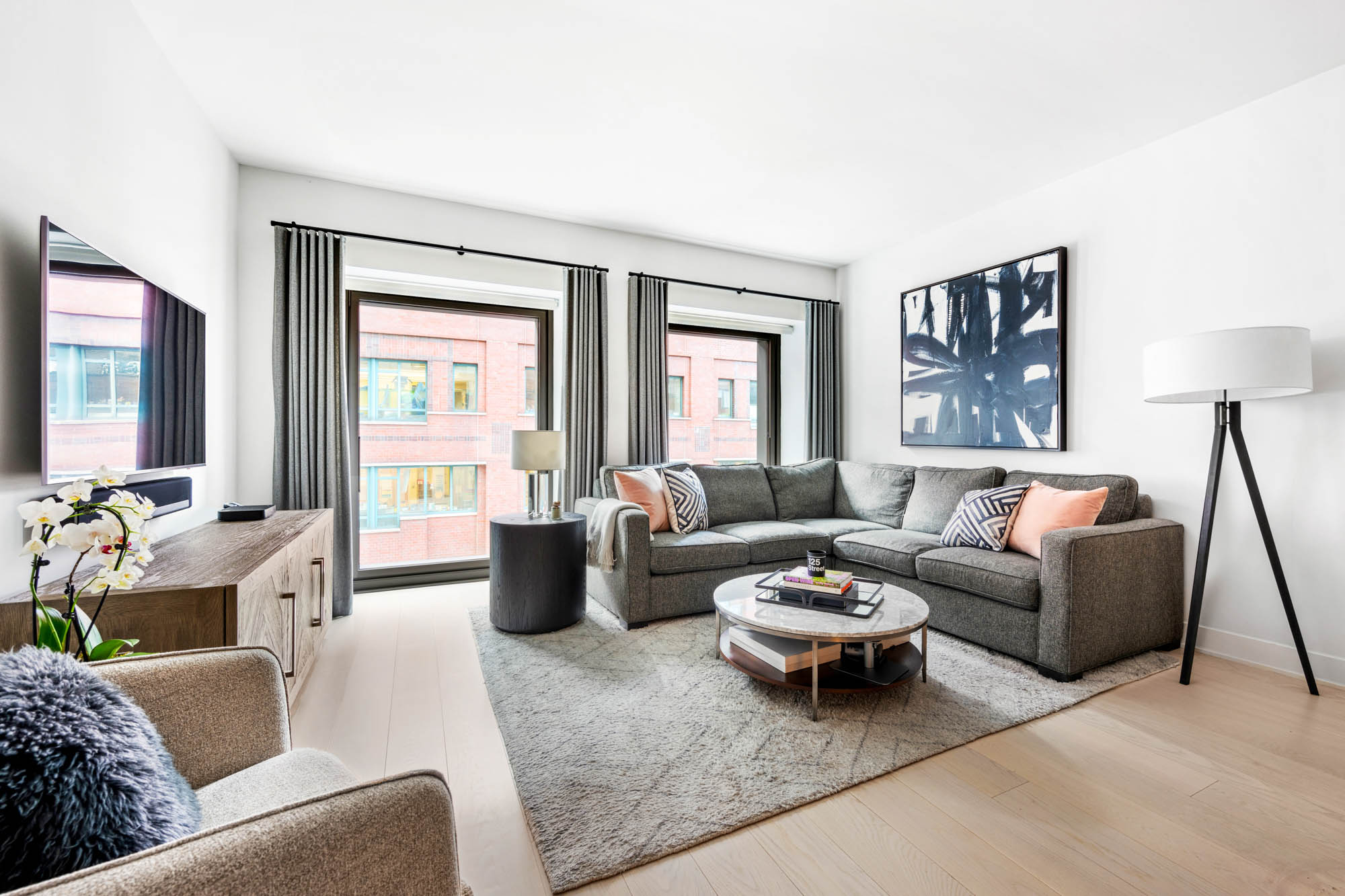 55 West 17th Street, Unit 701 Manhattan, NY 10011 - Photo 1 of 20 a living room with furniture and a large window