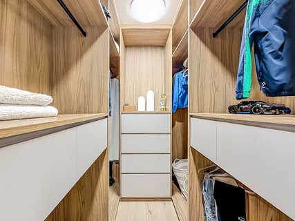 a balcony with furniture and a potted plant