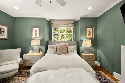 a bedroom with a bed and a couch