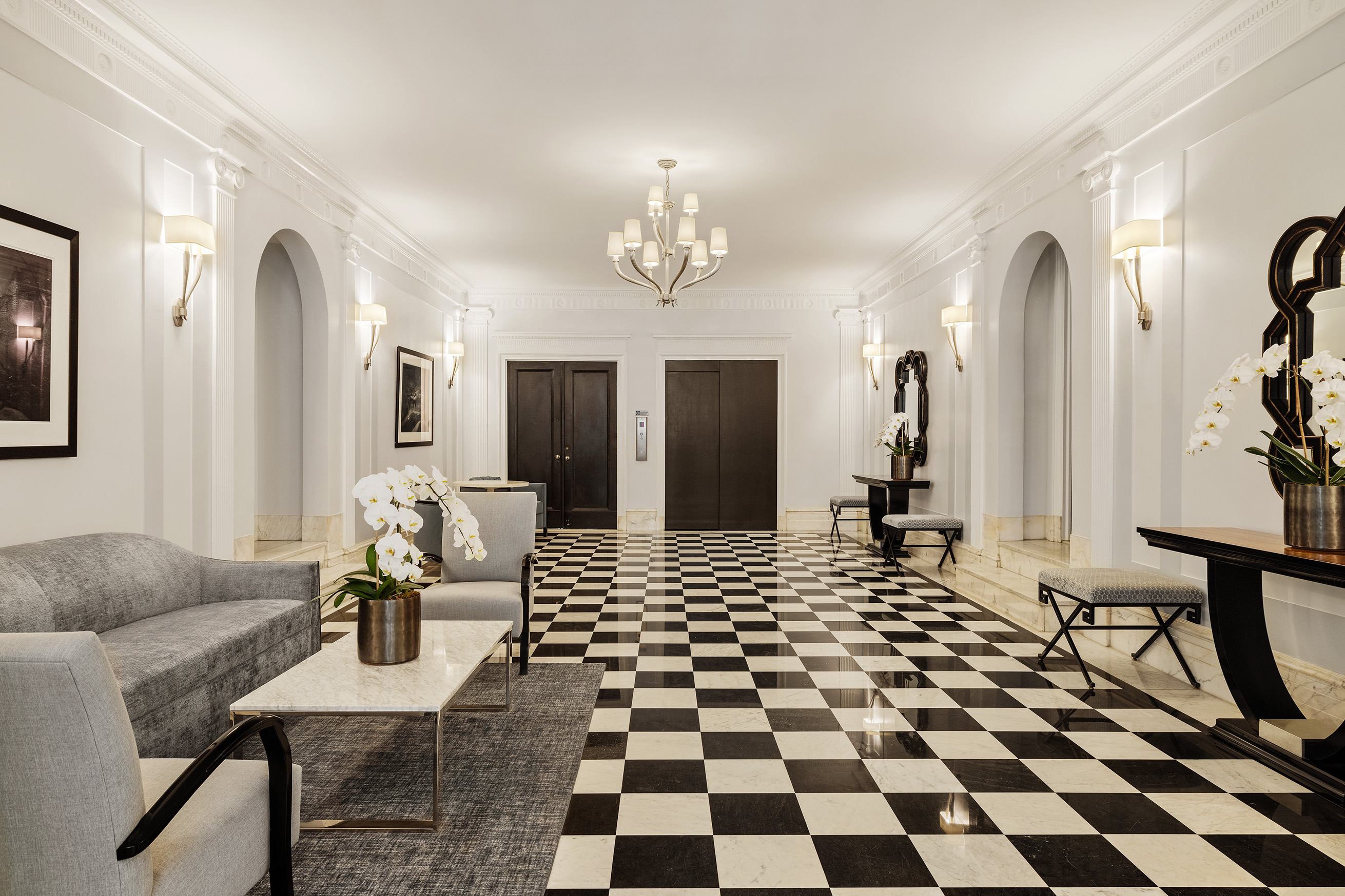 876 Park Avenue, Unit 9N Manhattan, NY 10075 - Photo 14 of 18 a living room with a black white checkered floor with couches chair and a coffee table