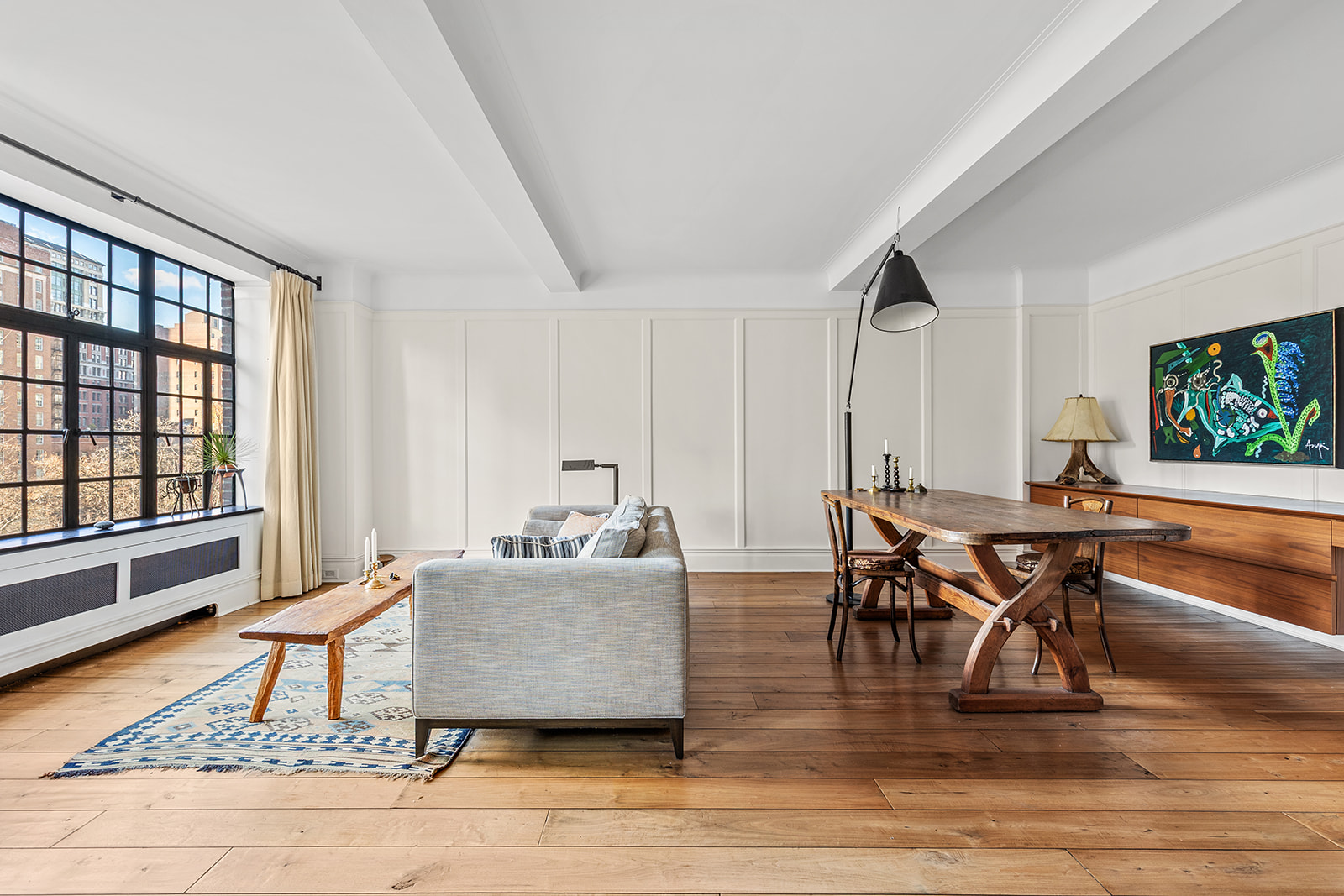 44 Gramercy Park North, Unit 8B Manhattan, NY 10010 - Photo 1 of 10 a living room with furniture and a table